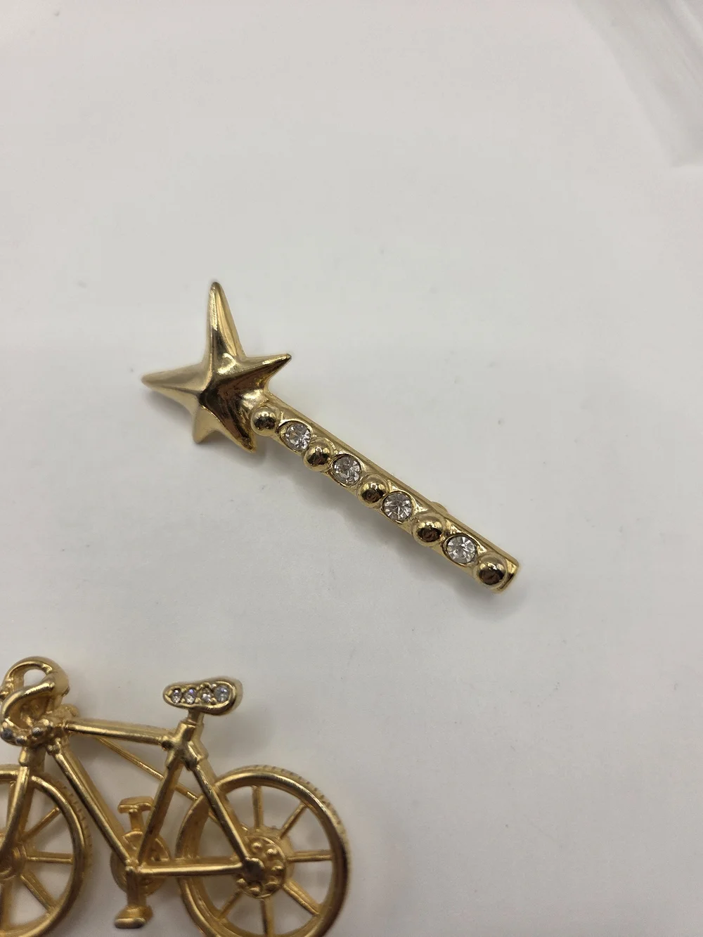 1569. Set Of Two Fun Gold Tone Brooches